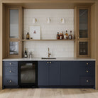 Wildwood Sconces in White + Brass. Interior Design by Alykhan Velji Designs