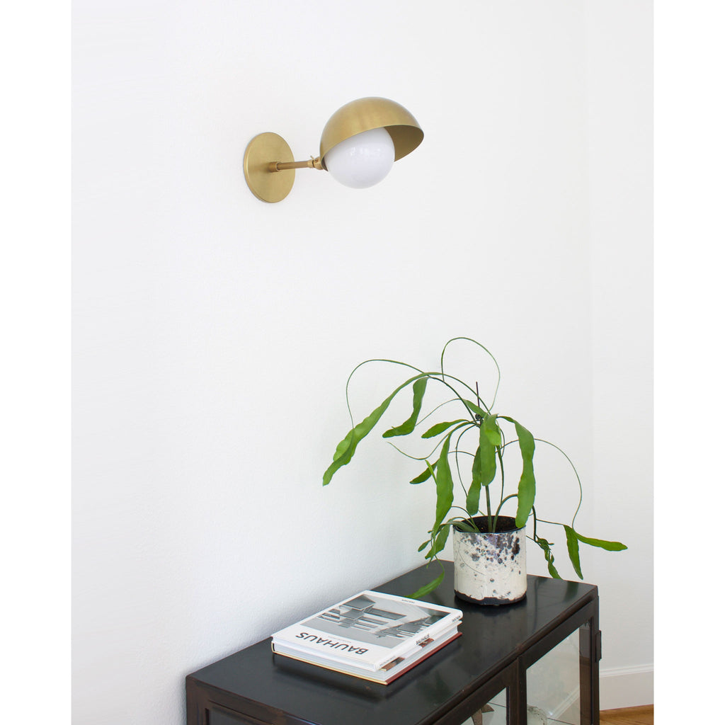 Noor Sconce shown in Heirloom Brass.