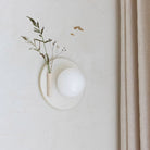 Ikebana Sconce shown in Natural White Glaze with Left mounted vase