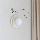 Ikebana Sconce shown in Natural White Glaze with Verdigris flower finish and Left mounted vase