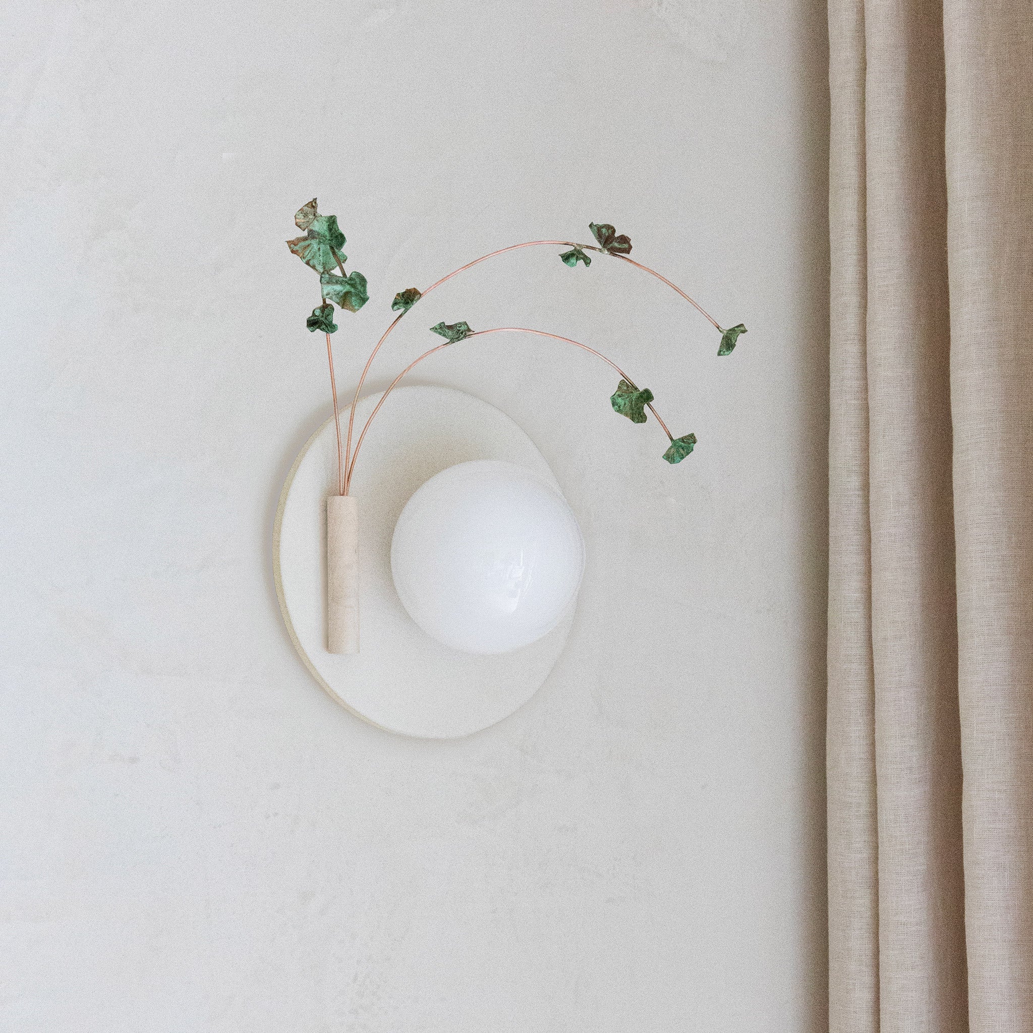 Ikebana Sconce shown in Natural White Glaze with Verdigris flower finish and Left mounted vase
