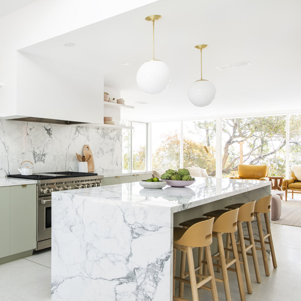 A Modern Kitchen With Pendant Lights