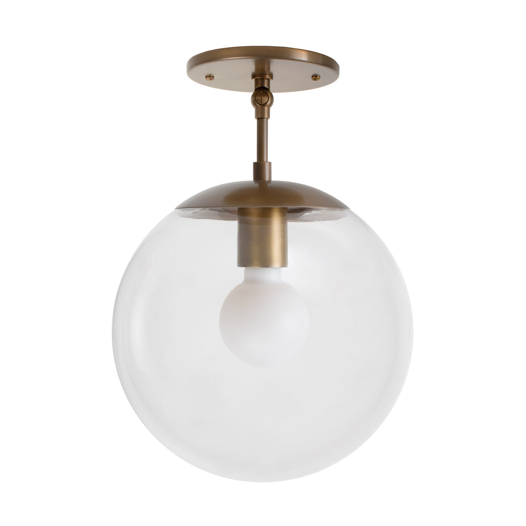 Alto Surface 10" for Vaulted Ceiling shown in Heirloom Brass with a Clear 10" globe.