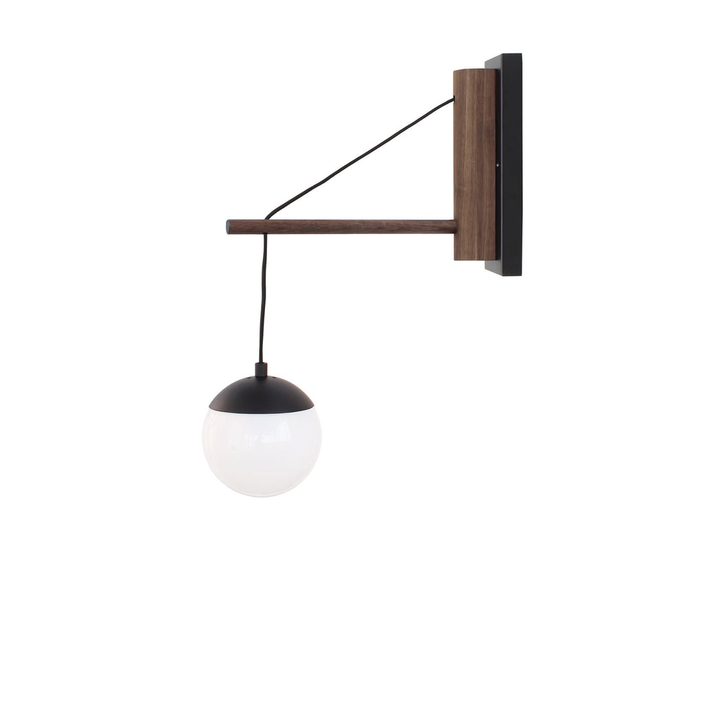 Alto 14" Wood Arm Sconce shown in Matte Black with Walnut, a 6" Opal globe, and a Black Hardwired Cord.