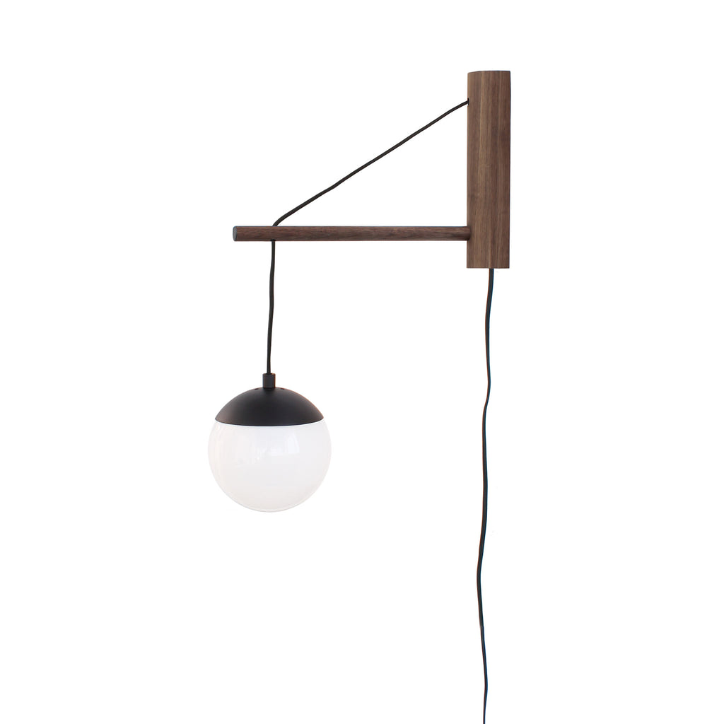 Alto 14" Wood Arm Sconce shown in Matte Black with Walnut, a 6" Opal globe, and a Black Plug-in Cord.