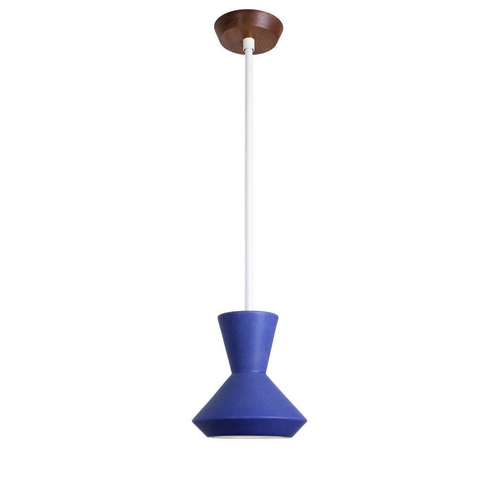 Bobbie Rod Pendant shown in Cobalt Blue Glaze ceramic with a White Metal finish and a Walnut canopy.