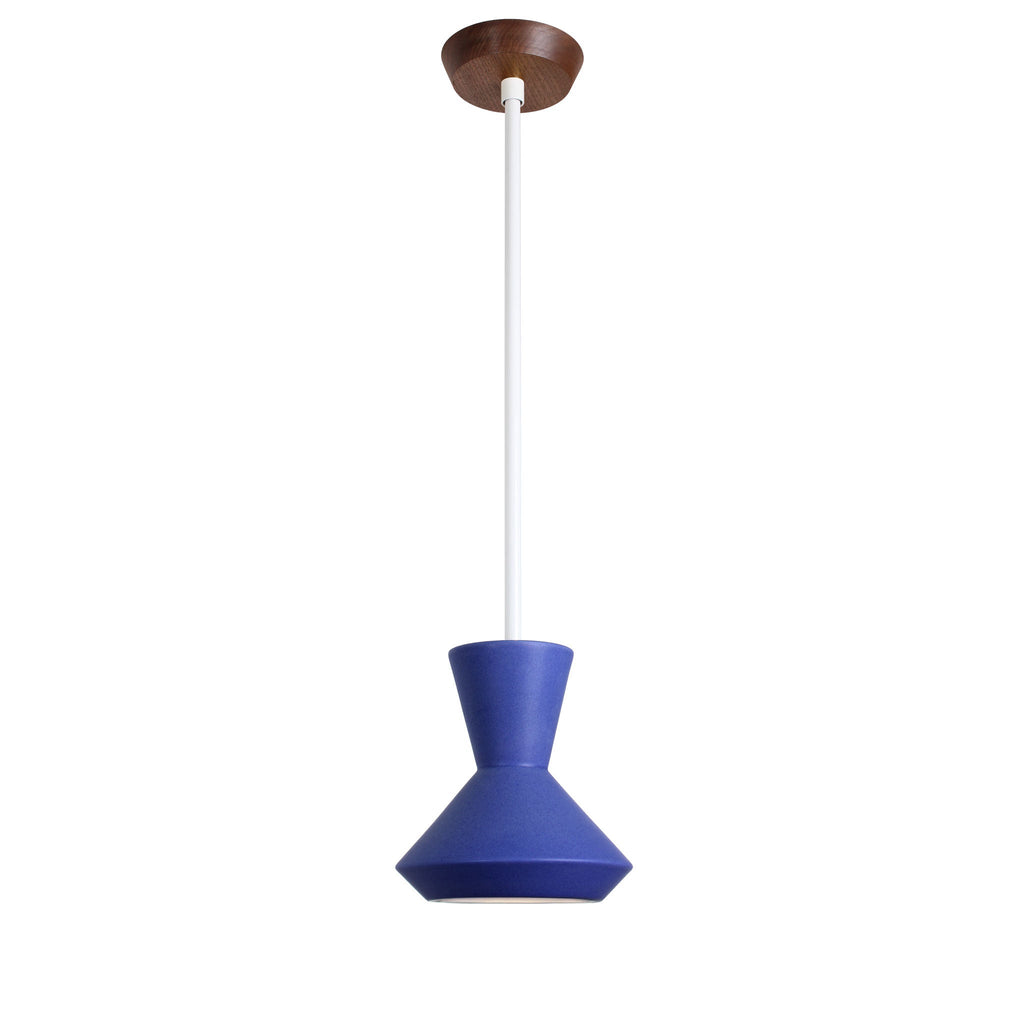Bobbie Rod Pendant for Vaulted Ceiling shown in Cobalt Blue Glaze Ceramic with a White Metal finish and a Walnut canopy.