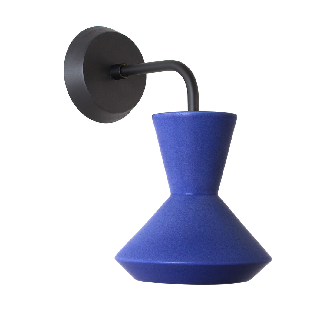 Bobbie Sconce shown in Cobalt Blue Glaze with Matte Black Metal and Black Stained wood finish Canopy.