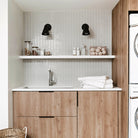 Tilt Cone shown in Matte Black with 6" arm. Interior design by AnnaBode + Co. Photo by Kelli Kroneberger