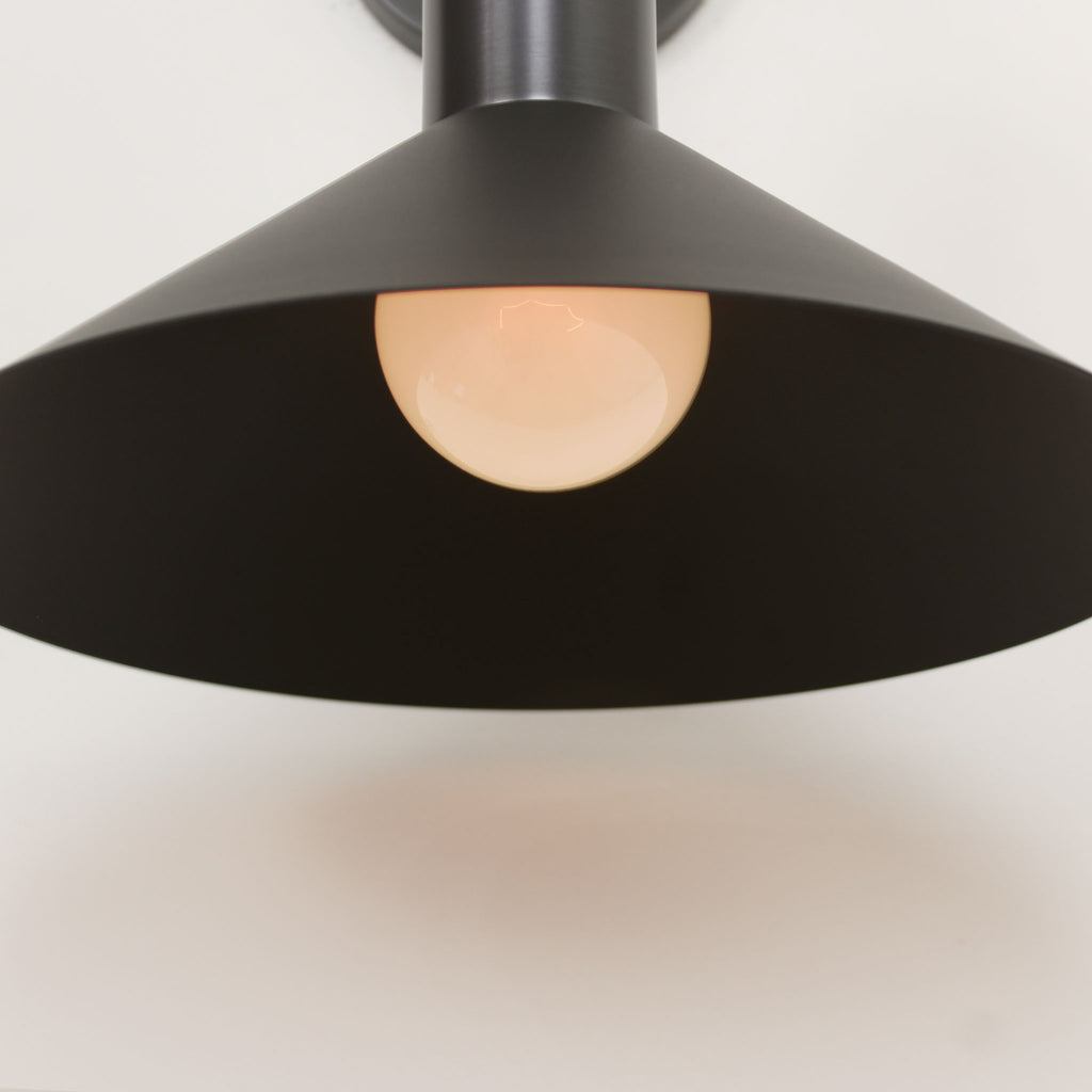 Juniper Sconce shown in Matte Black with Graphite Patina.