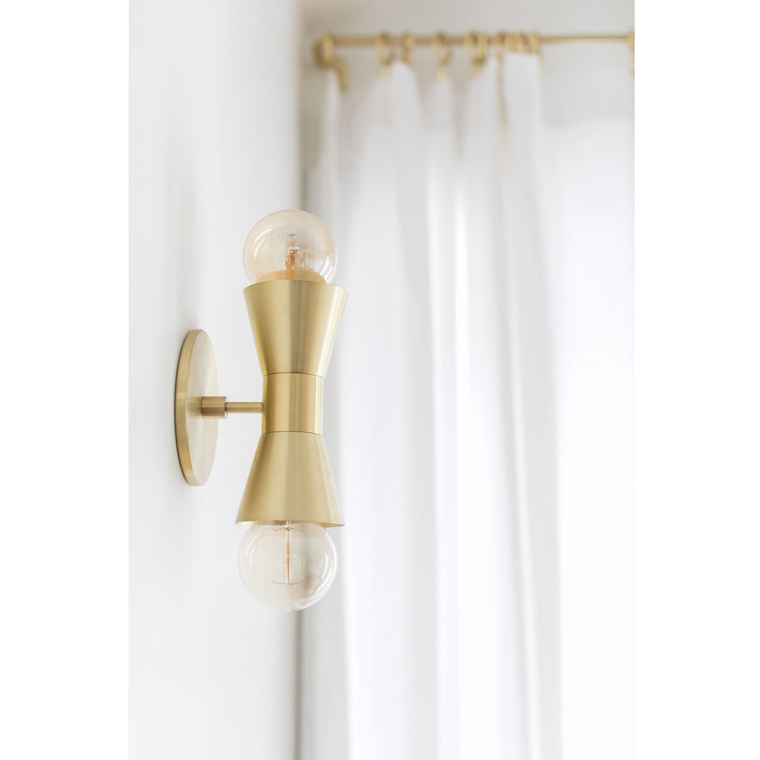 Mira shown in Brass. Interiors by Sarah Sherman Samuel for Sugar and Charm Studio
