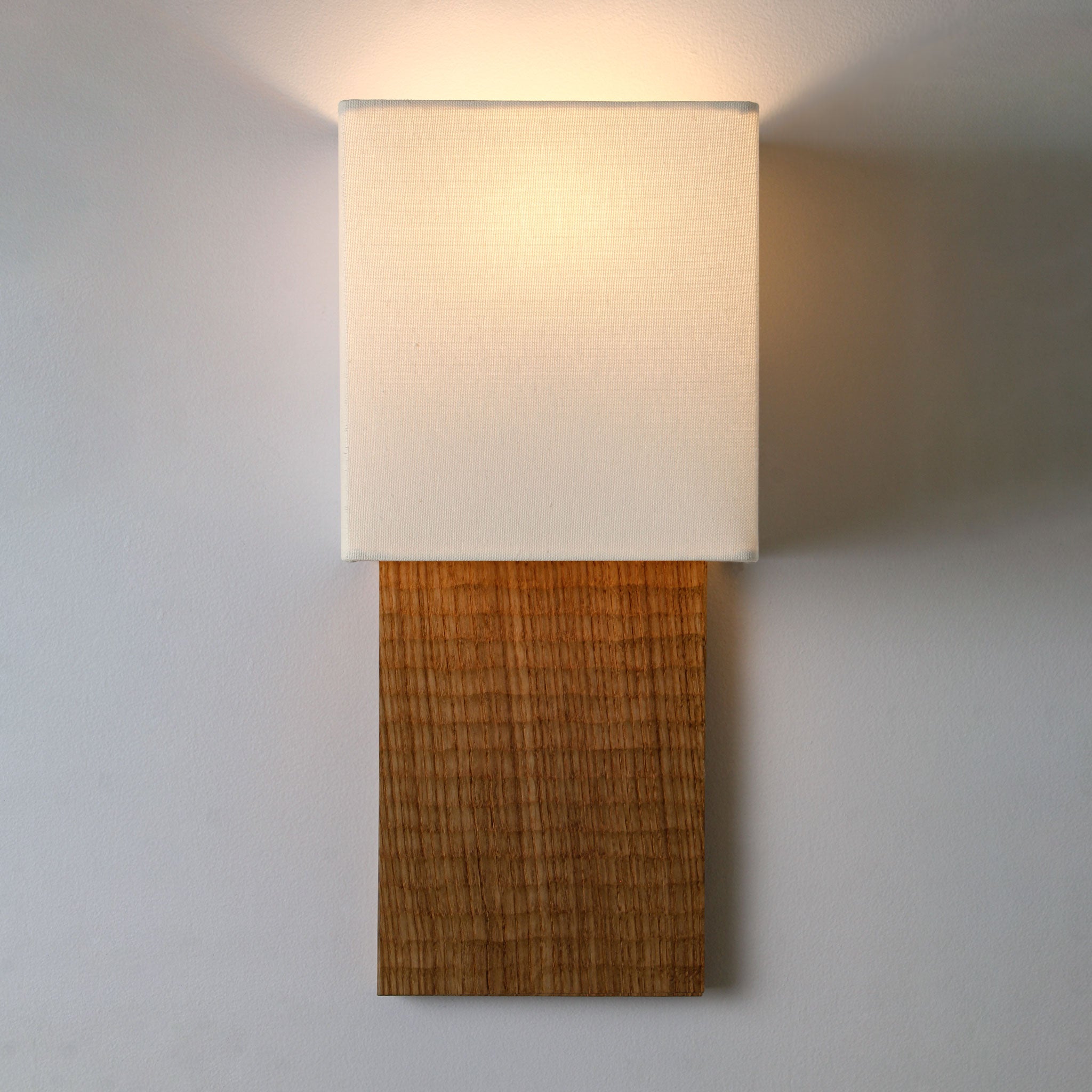 Ode Sconce shown in Oak