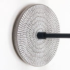 Sunflower canopy pattern shown in Brownstone White Ceramic with a Matte Black arm