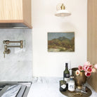 Terra Sconce shown in Bone ceramic finish with Brass metal, Interior Design by Ivy House Designs for Pigeon Hole Home Store