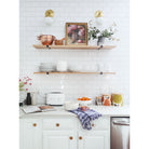 Alto Sconce 6" shown in Brass with an Opal 6" globe. Interiors by Erin Wheeler and Sunny Circle Studio