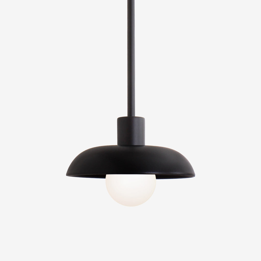 Terra Pendant for Vaulted Ceiling shown in Matte Black ceramic finish with Matte Black metal.