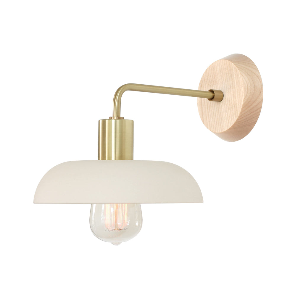 Terra Sconce with Wood Canopy shown in Bone Ceramic with Brass metal and Maple canopy.