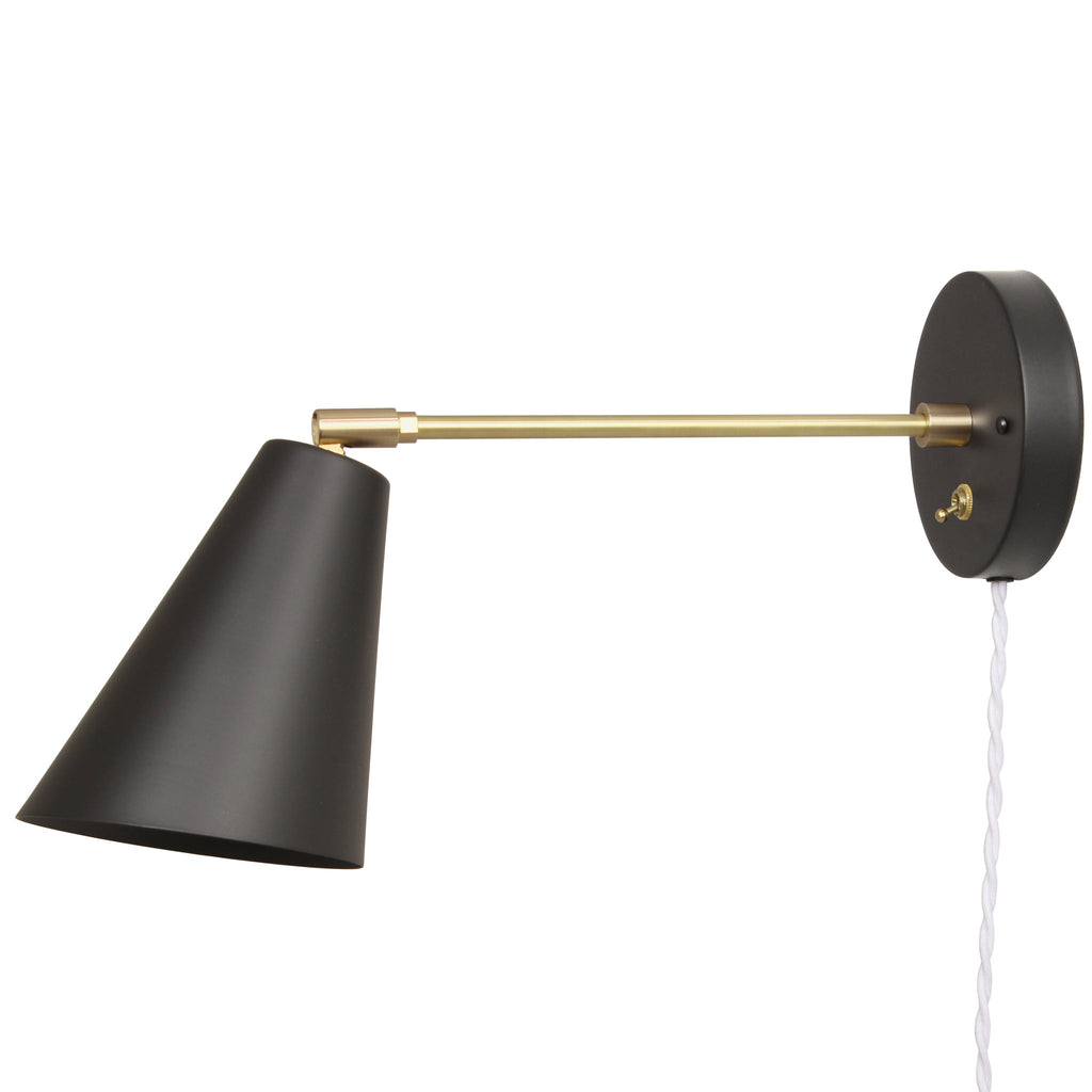 Cedar and Moss. Tilt Cone - 9" arm. Shown in Matte Black + Brass with Brass switch and white cord.