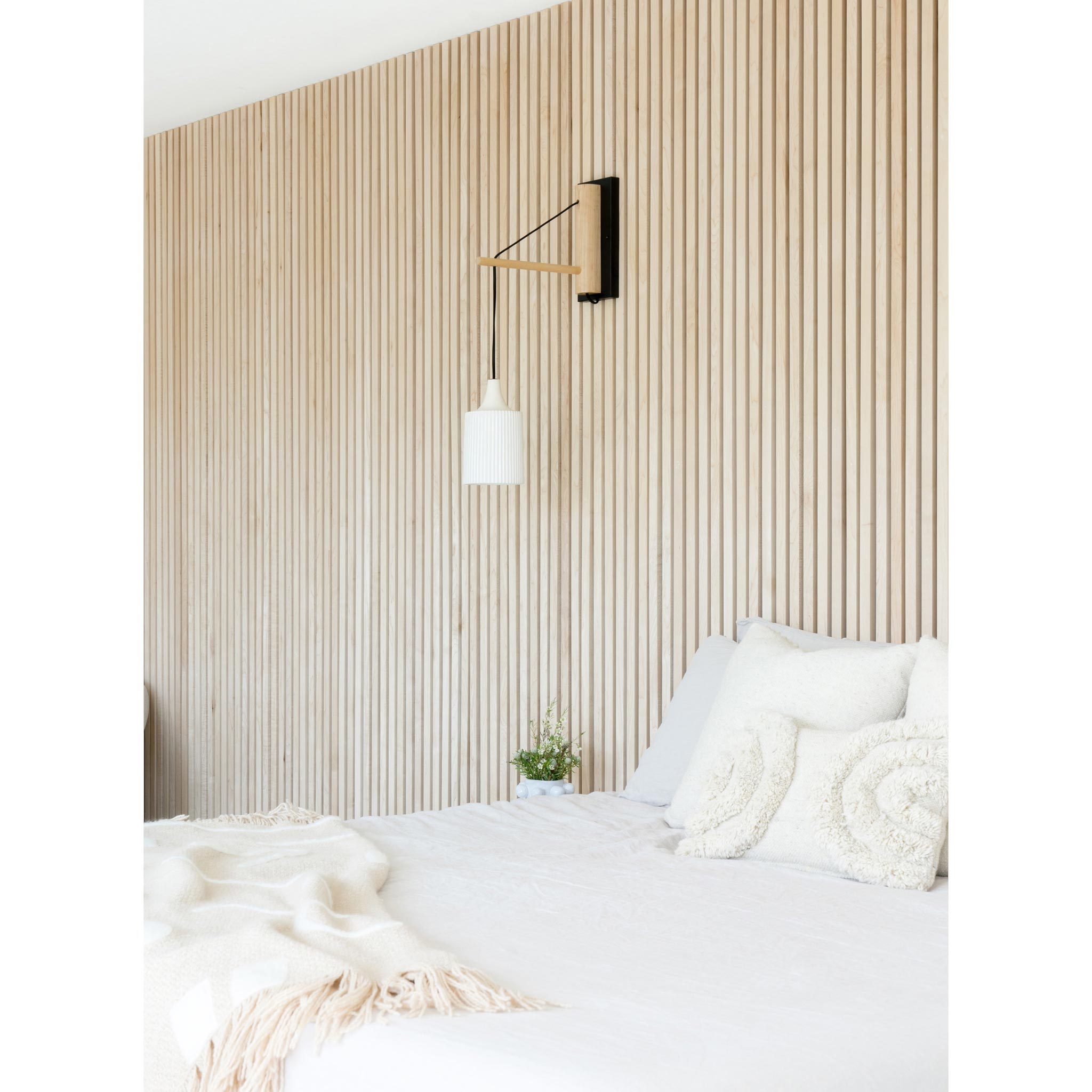 Tumwater 14" Wood Arm Sconce shown in Matte Black with Birch and a Black Hardwired Cord. Interior Design by Naber Design. Photo by Charlotte Lea Photography.