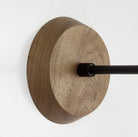 Wood canopy shown in Walnut with Matte Black arm