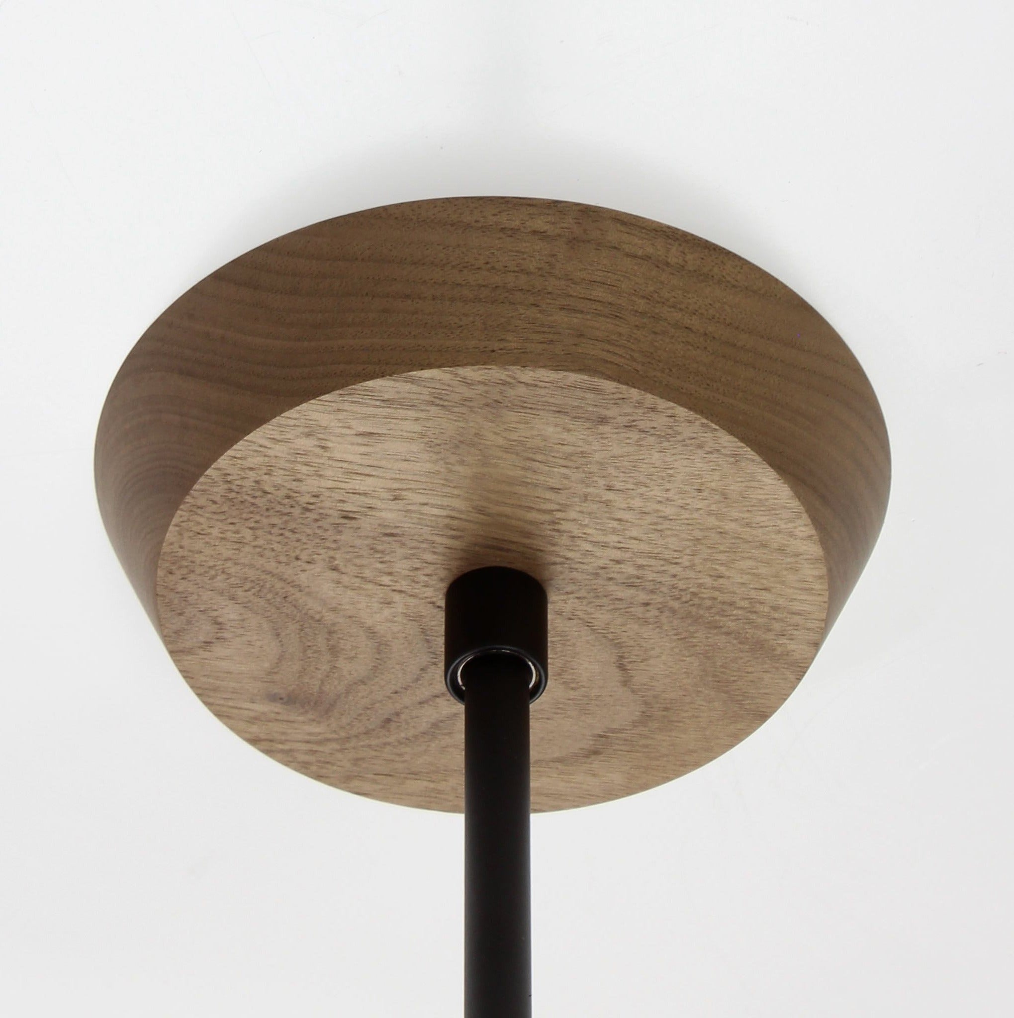 Mounting canopy shown in Walnut with Matte Black rod