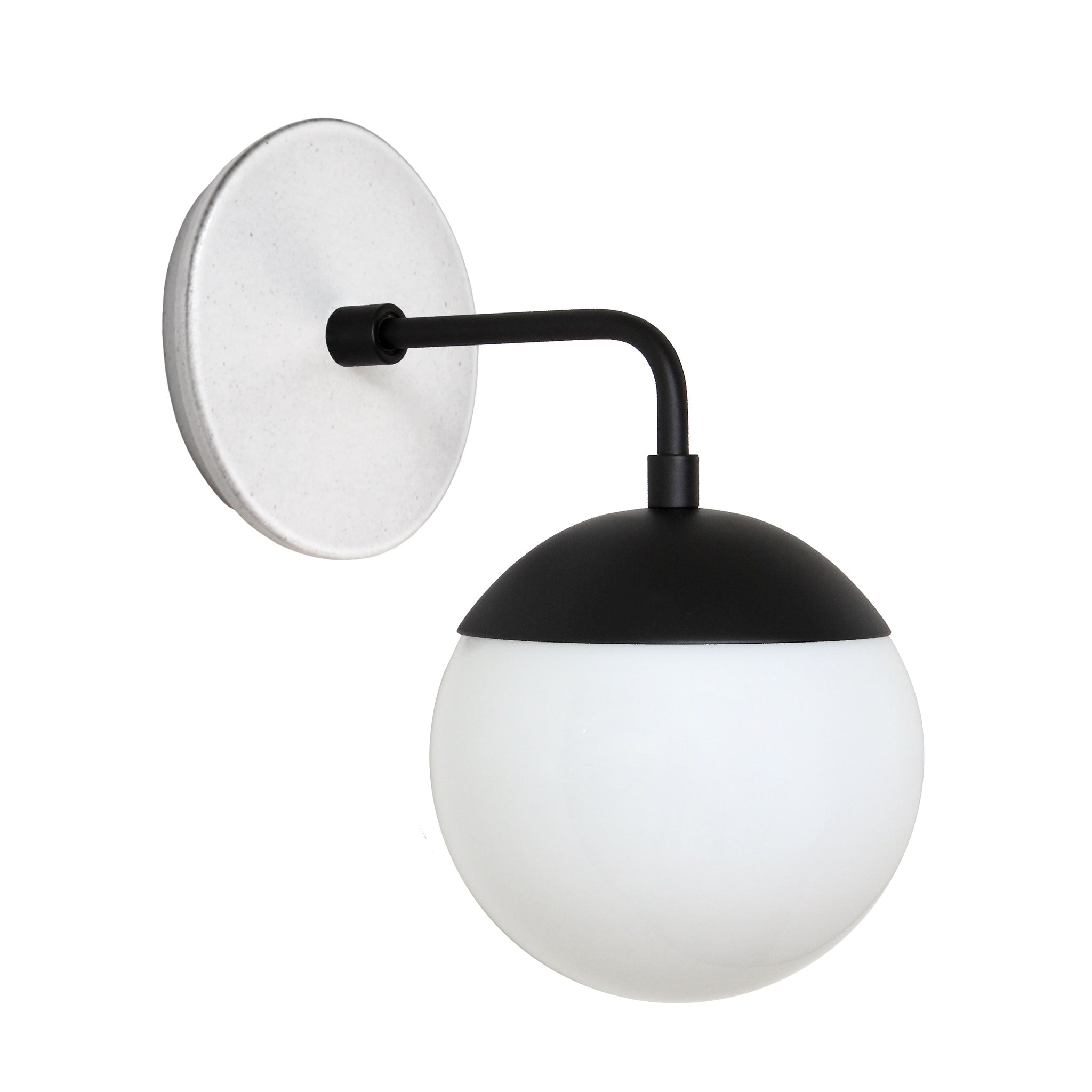 Alto Sconce 6" with Ceramic Canopy shown in Matte Black with a Brownstone White Swift Ceramic Canopy Pattern and an Opal 6" globe