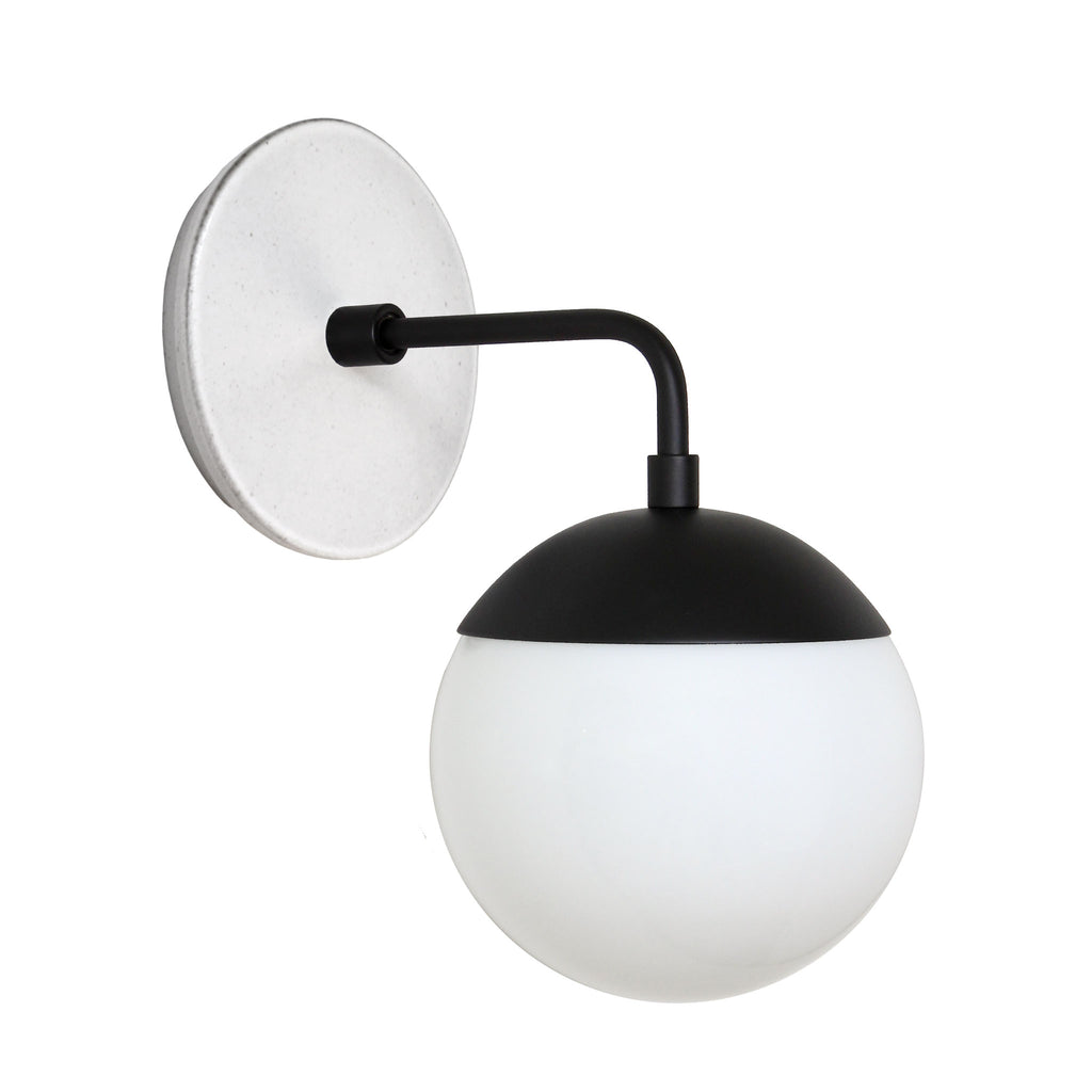 Alto Sconce 6" with Ceramic Canopy shown in Matte Black with a Brownstone White Swift Ceramic Canopy Pattern and an Opal 6" globe.