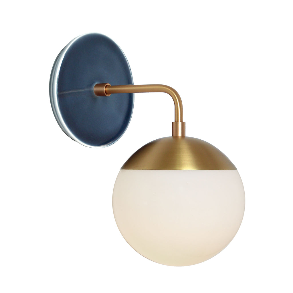 Alto Sconce 6" with Ceramic Canopy shown in Brass with an Indigo Blue Swift Ceramic Canopy Pattern and an Opal 6" globe.