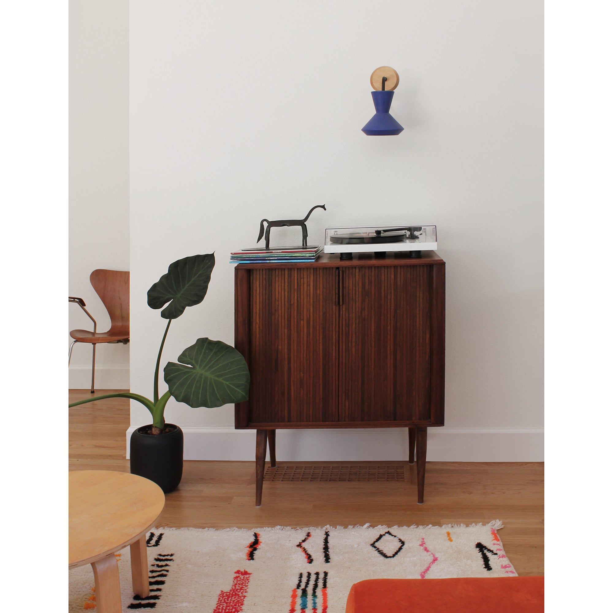 Bobbie Sconce shown in Cobalt Blue Glaze with Matte Black Metal and Maple Canopy