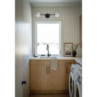 Heron Double Sconce shown in Matte Black. Interior Design by KH Interiors