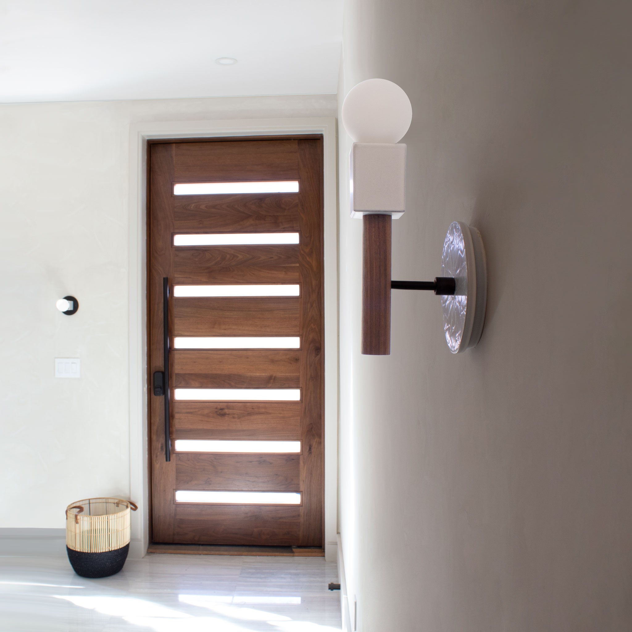 Seneca Sconce shown with a Star pattern Brownstone White ceramic canopy, Matte Black and Walnut