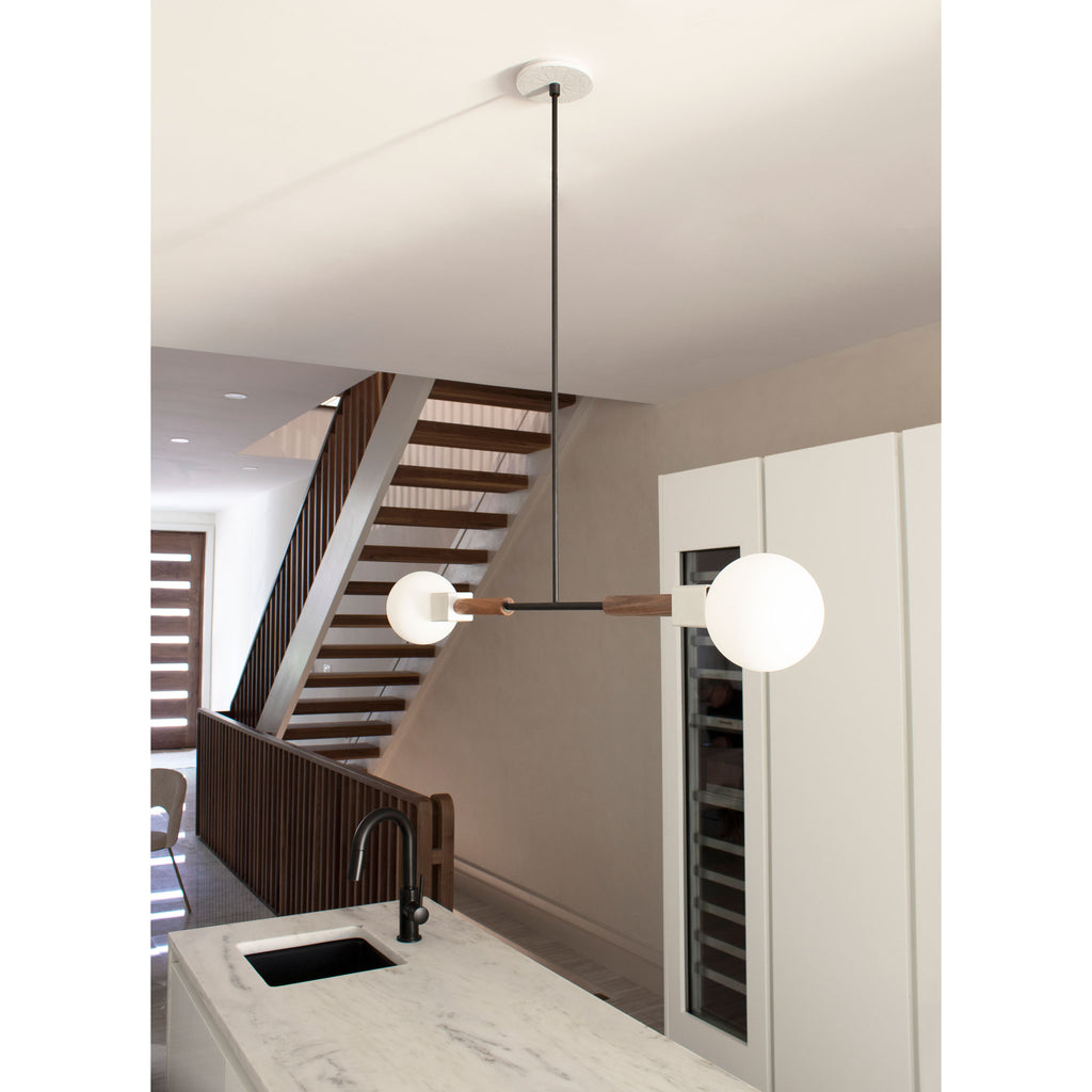 Stanton Pendant shown in Walnut with Swift canopy pattern in Brownstone White Ceramic.