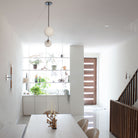 Stanton Pendant shown in Walnut with Matte Black canopy