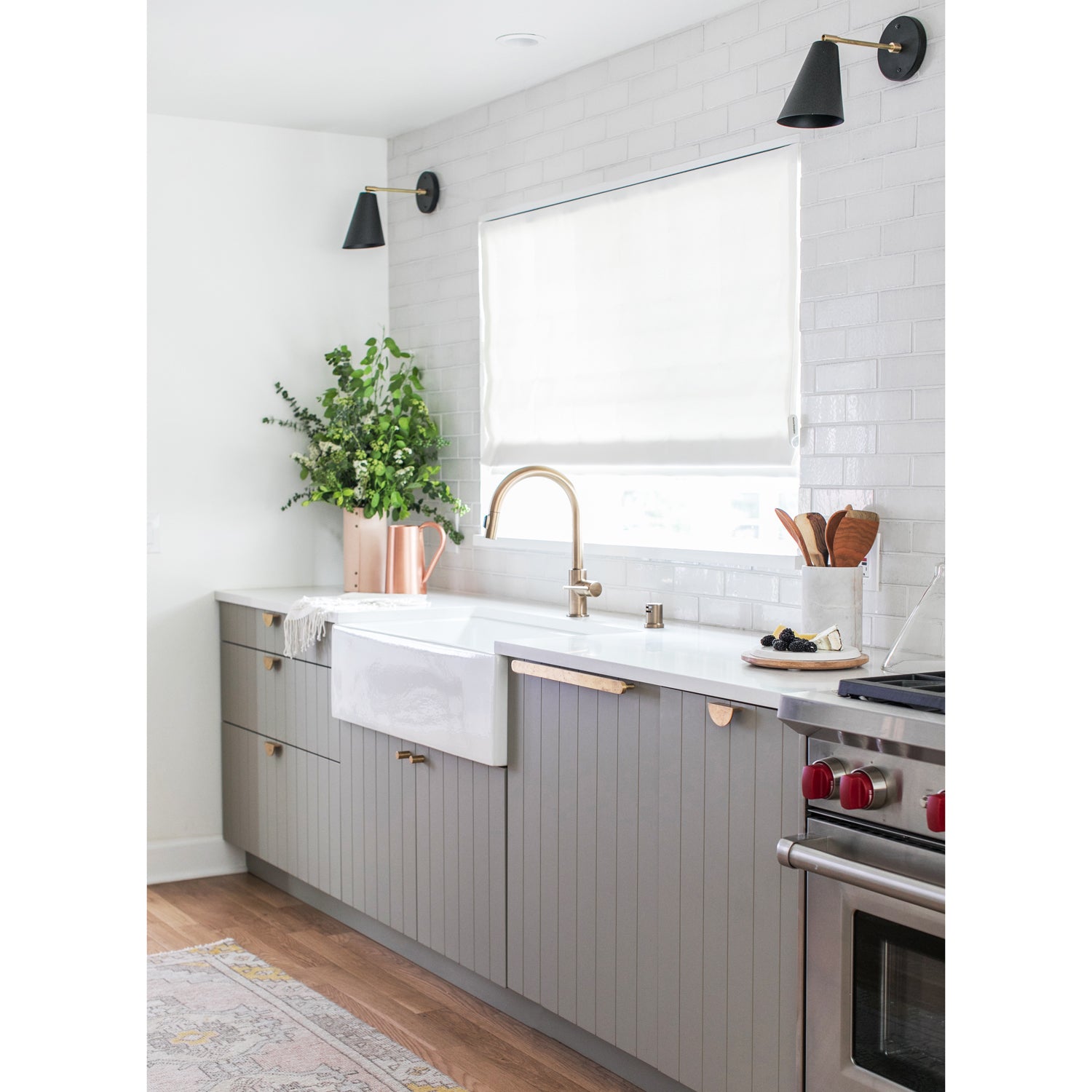 Tilt Cone shown in Matte Black and Brass finish with a 6" arm. Interior design by Sarah Sherman Samuel for Sugar and Charm Studio