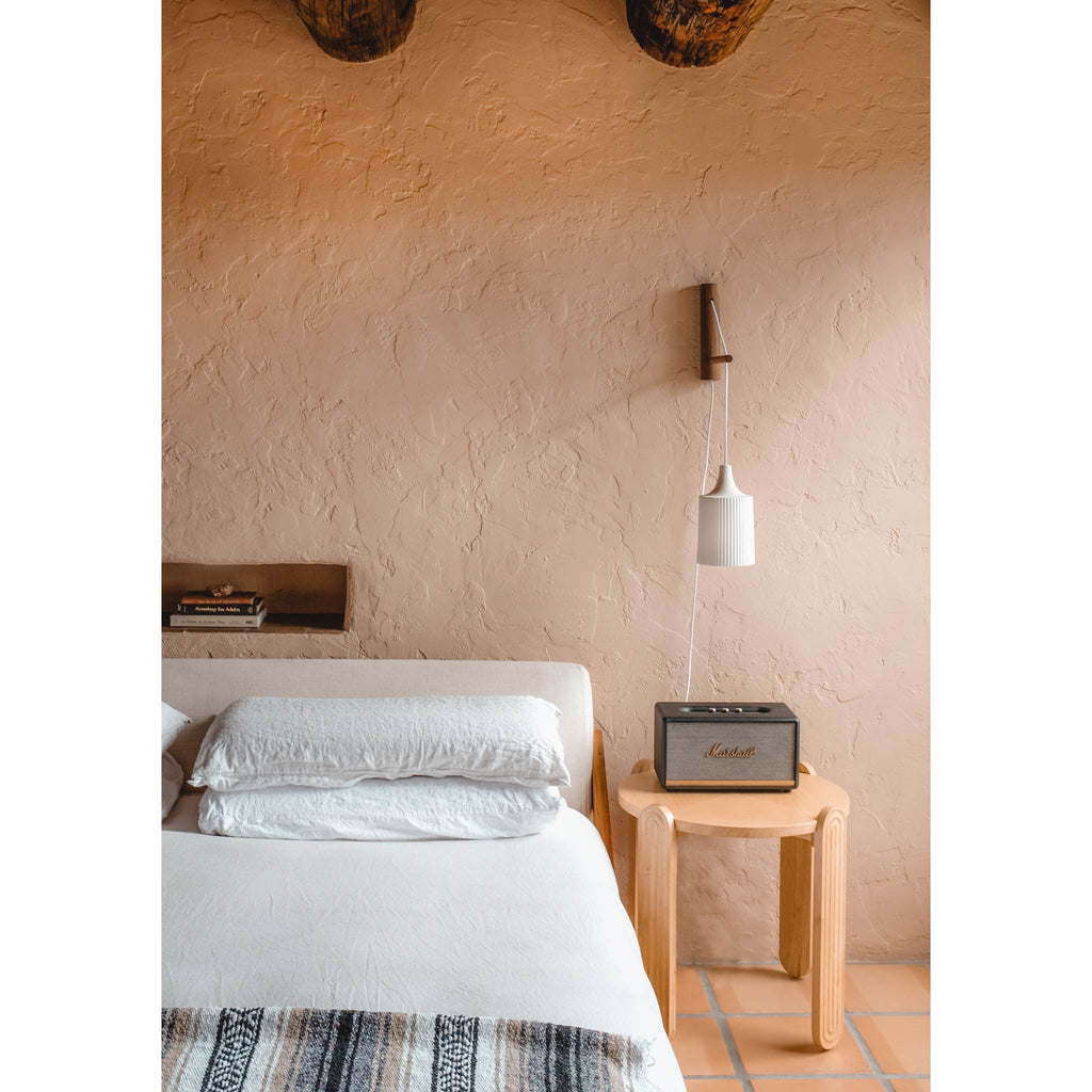 Tumwater 14" Wood Arm Sconce shown in Walnut with a White Plug-in Cord. Photo by Posada Inn by The Joshua Tree House