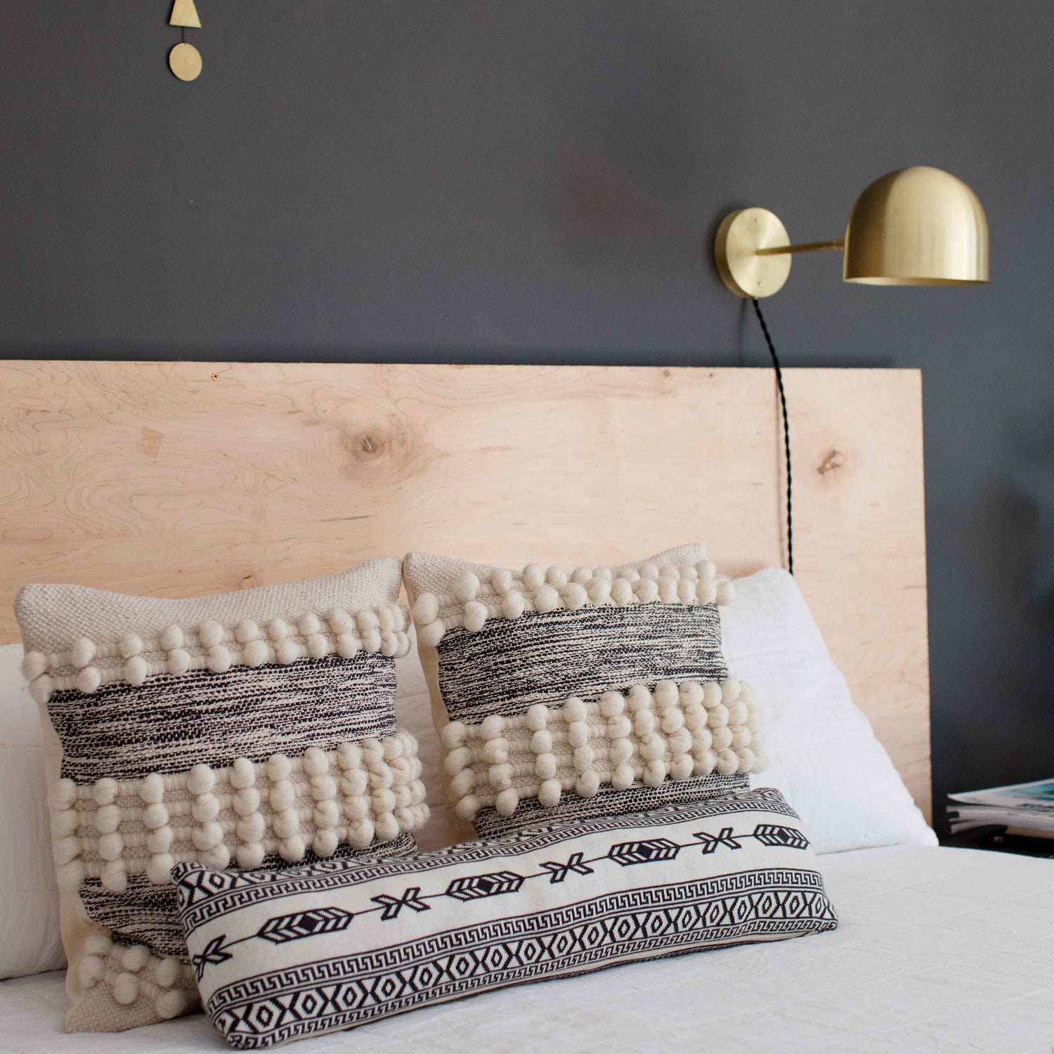 Amélie Sconce 8" shown in Brass with a Black Twisted Cloth Cord. Interior Design by Erin Barrett of Sunwoven. Photo by Margeret Wright.