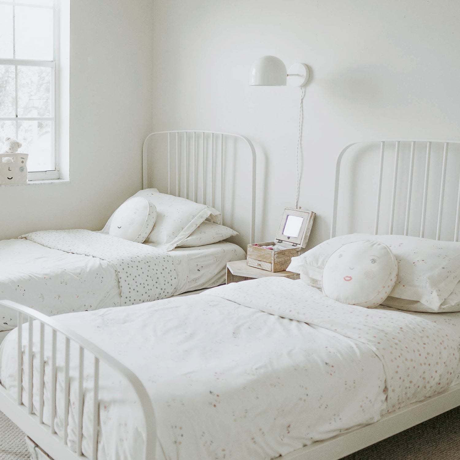 Amélie Sconce 8" shown in White with Brass with a White Twisted Cloth cord. Interior Design by 41 Studios. Photo by Laura Palacios.