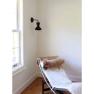 Bobbie Sconce shown in Eclipse Black Glaze with Matte Black Metal and Black Stained Wood finish Canopy