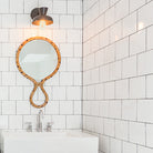 Isle Sconce shown in Matte Black. Interior Design by Teal Davison Design