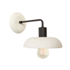 Terra Sconce shown in Bone ceramic finish with Matte Black metal