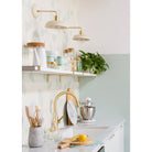 Terra Sconces in Bone ceramic finish with Brass metal. Design by Joy Cho and Sarah Sherman Samuel, Photo by Monica Wang