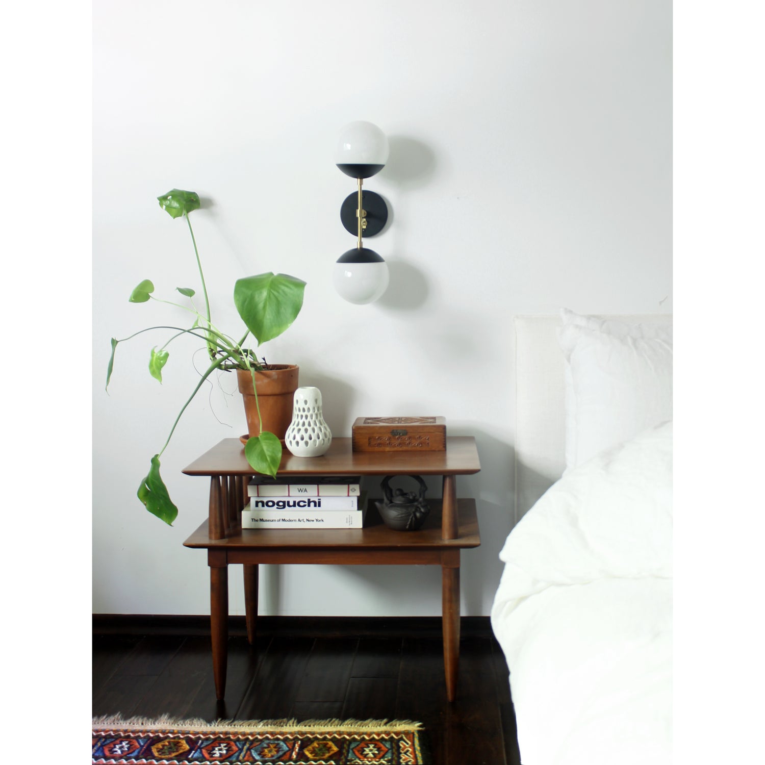 Theo shown in Matte Black and Brass with Opal 6" globes