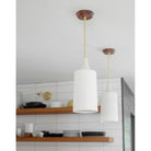 Tumwater Large Pendant shown in Brass with Walnut canopy. Interior design by Erin Barrett of Sunwoven. Photo by Margeret Wright