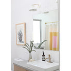 Isle Sconce in White with Brass. Interior Design by Amanda Dawbarn of 100 Layer Cake. Photo by Jeff Mindell