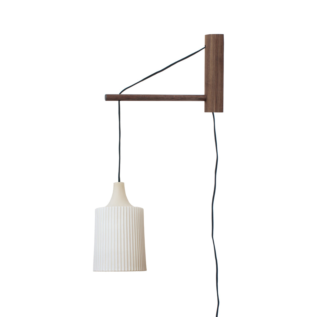 Tumwater 14" Wood Arm Sconce shown in Walnut with a Black Plug-in Cord.