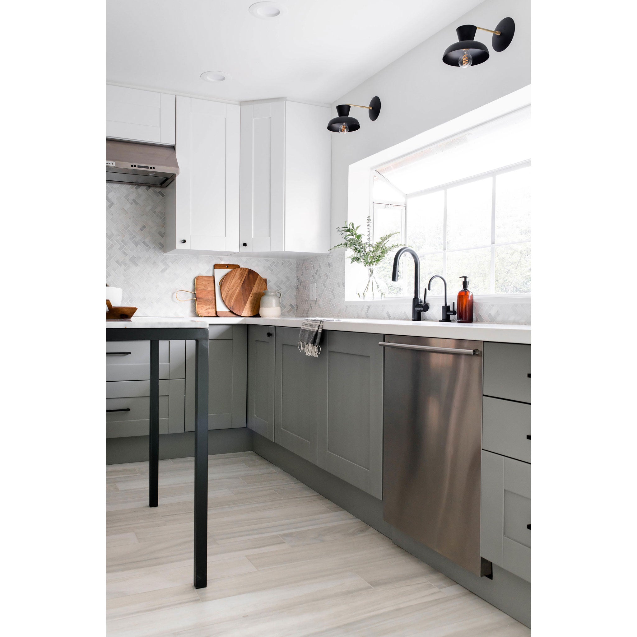 Isle Sconces shown in Matte Black with Brass. Interior Design by The Habitat Collective. Photo by Christine Michelle Photography