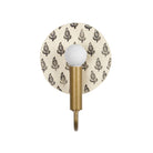 Edith ADA Sconce shown in Heirloom Brass with Black and Cream Floral Ceramic