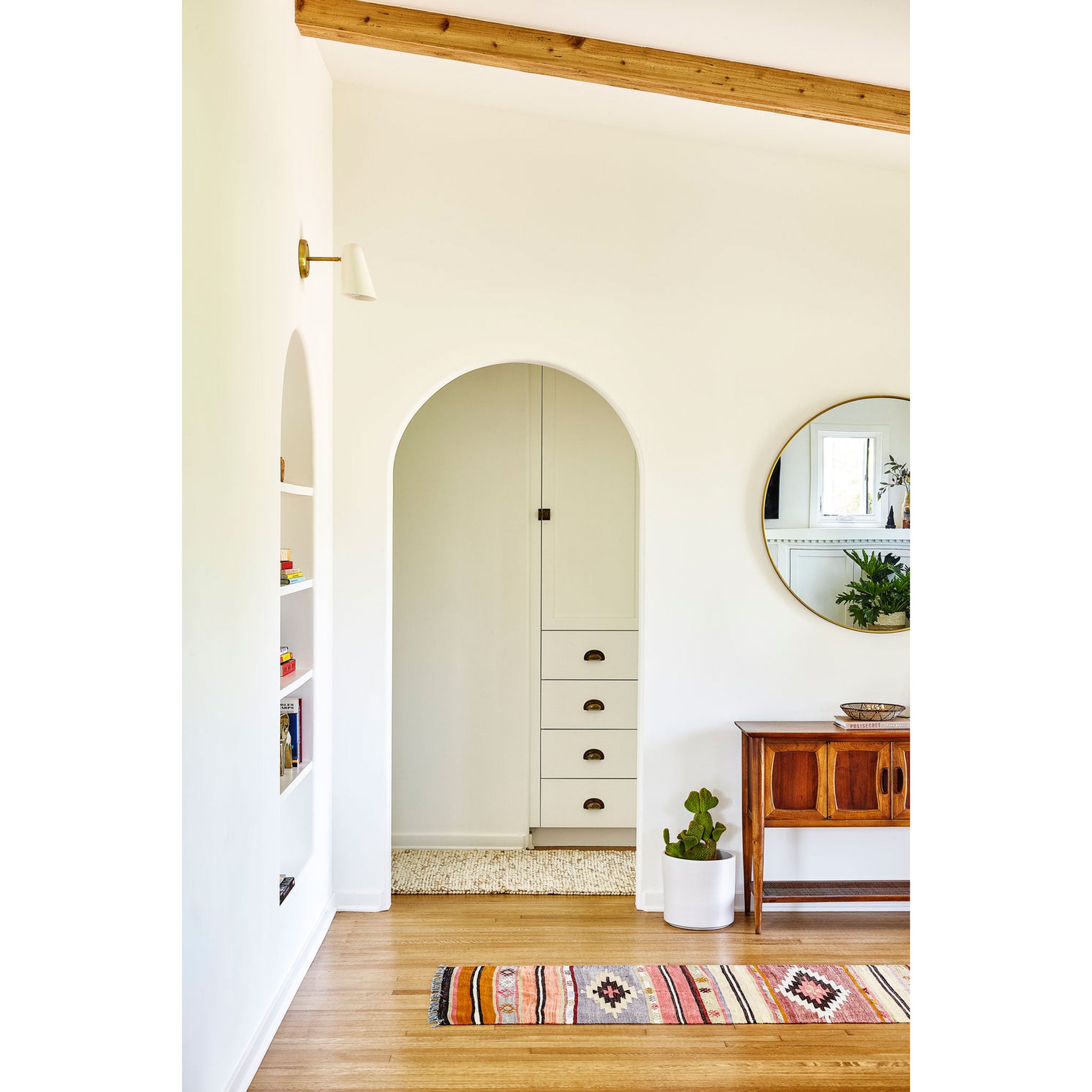 Wildwood shown in White with Brass canopy and arm. Interior Design by Byrdesign. Photo by Heidi's Bridge